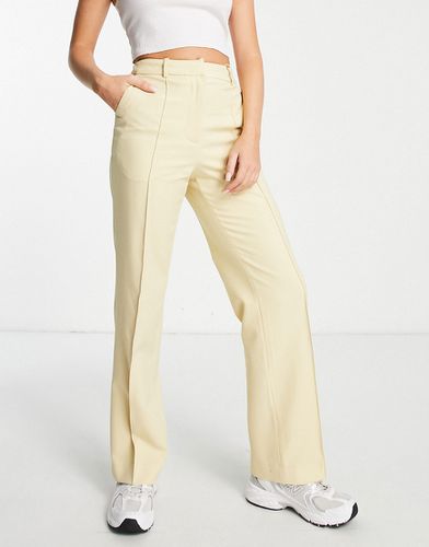Pantaloni sartoriali a vita alta con fondo ampio color latticello in coordinato - Aligne - Modalova