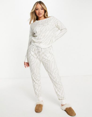 Top a maniche lunghe e joggers crema zebrato con logo - DKNY - Modalova