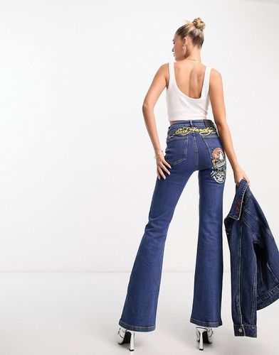 Jeans aderenti a zampa con logo sul retro-Blu - Ed Hardy - Modalova