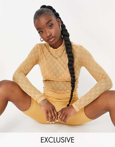 In esclusiva per ASOS - - Infuse - Top attillato a maniche lunghe marrone con stampa - Puma - Modalova