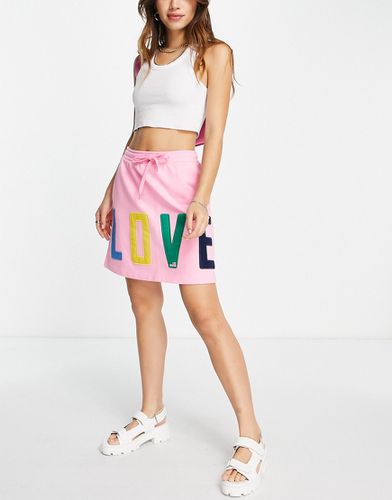 Minigonna rosa in jersey con logo - Love Moschino - Modalova
